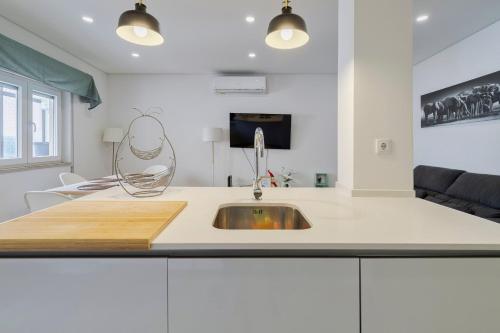 a kitchen with a sink and a counter top at Fonte Nova Nest, By Home Match in Setúbal