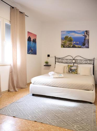 a bedroom with a large white bed in a room at La Stellina Capri in Capri