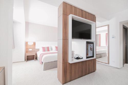 Ramada Plaza Craiovaにあるベッド