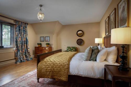 a bedroom with a large bed and a window at Rubens Rooms in Peterborough