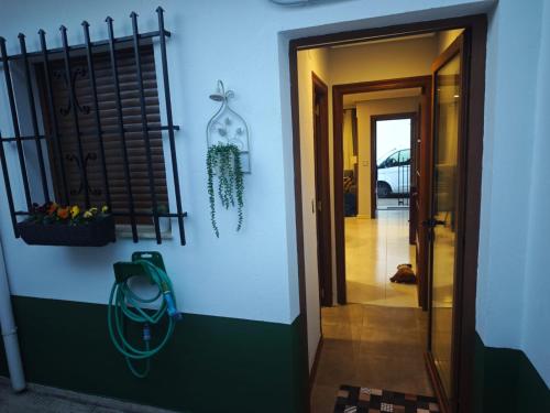 a hallway leading to a room with a door at Mansilla Petit Inn in Mansilla de las Mulas