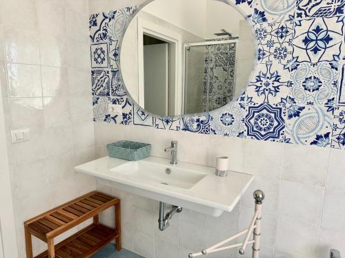 a bathroom with a sink and a mirror at Capraia,Elba in San Vincenzo
