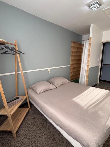 a bedroom with a bunk bed and a ladder at California in Maretz