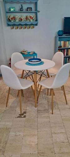 a table and chairs in a living room with a table and chairs at Casa Susy in Rome
