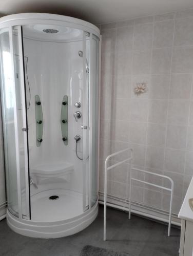 a shower with a glass door in a bathroom at Maison 'Dédé' in La Chapelle-Taillefert