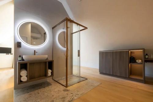 a bathroom with a sink and a mirror at Cozmoss Boutique Hotel in Erica
