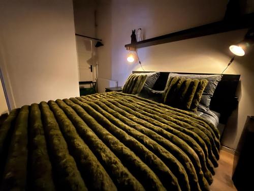 a bedroom with a large bed with two pillows at B&B Goeje Morge in Ammerzoden