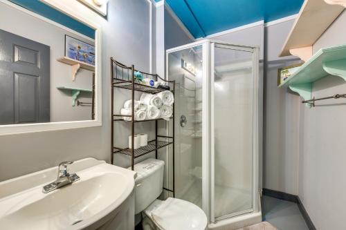 a bathroom with a toilet sink and a shower at 1 Mi to Ocean Isle Beach! Studio w/ Outdoor Oasis in Ocean Isle Beach