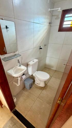 a bathroom with a toilet and a sink at Casa da Duna Moitas-Icaraizinho de Amontada Ceará in Praia de Moitas