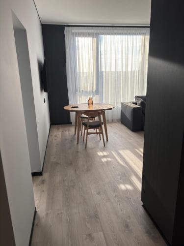 a dining room with a table and a chair at Bavaro apartments 5 in Ivano-Frankivsk