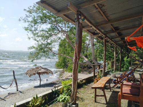 a view of the beach from a beach house at Miraflores Beach Lodge in Santo Domingo