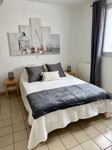 a bedroom with a large bed in a room at Gites des Lavandières in Cour-Cheverny