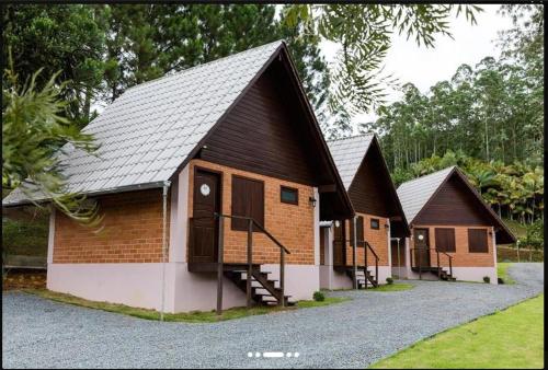 a group of cottages with stairs leading to them at Pousada Casarão Gastehaus in Pomerode