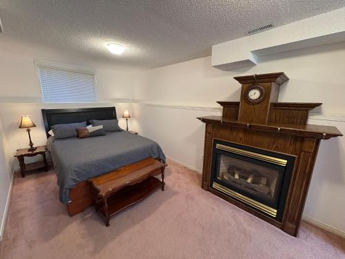 a bedroom with a bed and a fireplace at Wasaga Dunes in Wasaga Beach