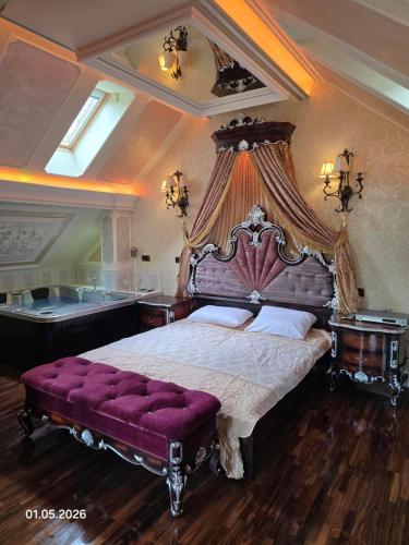 a bedroom with a large bed and a bath tub at PIOTROWSKi HOUSE in Ropica Górna