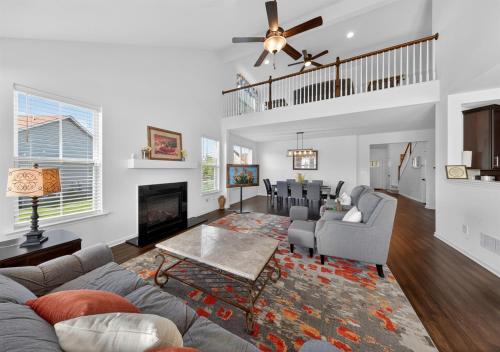 a living room with a couch and a fireplace at Spacious Family Gathering Space Privacy Zones Quiet, Convenient Neighborhood in Middletown