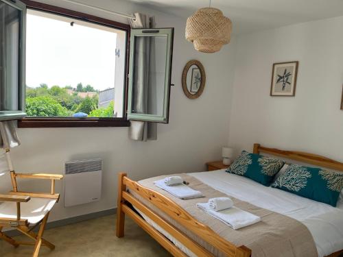 Llit o llits en una habitació de Fleur d'eau
