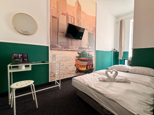 a room with two beds and a mirror and a desk at Royal Aparthotel Piotrkowska 116 in Łódź