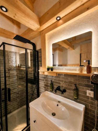 a bathroom with a sink and a shower at Das Seehaus Buckow in Buckow