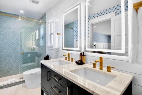 a bathroom with a sink and a shower at Tropic Isle At Anna Maria Island Inn in Bradenton Beach