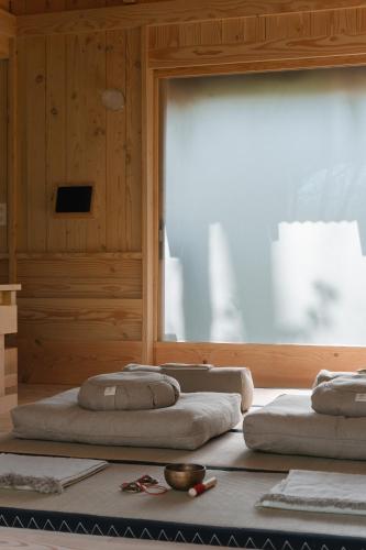 three beds sitting in a room with a window at Yogi's Cabin in Battle