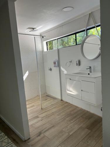 a bathroom with a sink and a mirror at Hostal Doñihue in Doñihue