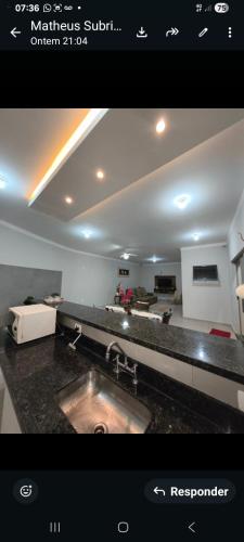 a picture of a kitchen with a sink in a room at Recanto Rafaela 2 in Olímpia