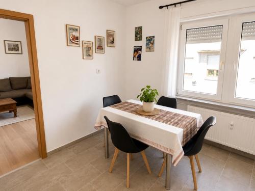 a dining room with a table and chairs at Ferienwohnung Ernzerhof in Idar-Oberstein