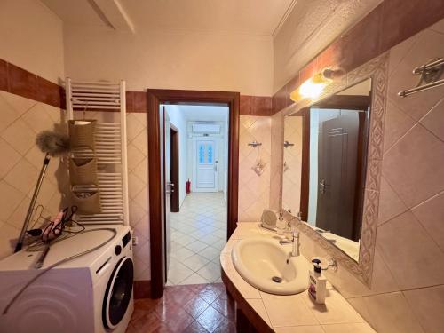 a bathroom with a sink and a mirror at Krithia Apartment with Garden Family Apartment in Krithiá