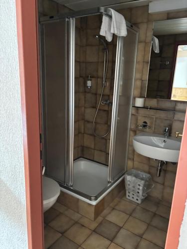 a bathroom with a shower and a sink at Kronenlodge in Seefeld in Tirol