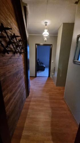 a hallway with a room with a door and a hallwayngthngthngthngthngth at Helme mõis in Helme