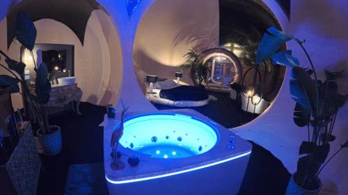 a bathroom with a bath tub in the middle of a room at Bubble Glamping Sicily in Trecastagni