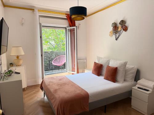 Llit o llits en una habitació de SCI IMMO VOLTAIRE