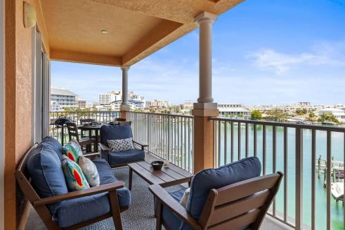 a balcony with chairs and a view of the city at Harborview Oasis in Clearwater Beach in Clearwater Beach