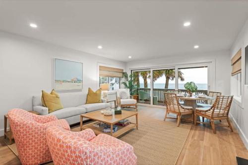 a living room with a couch and a table at Beachfront Aldea 12 in Clearwater Beach