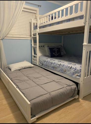 a bedroom with two bunk beds in a room at Hilton Head Resort in Hilton Head Island
