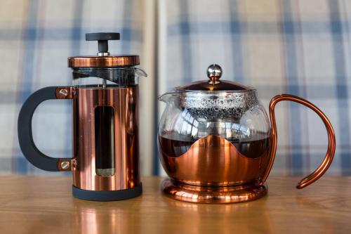 a coffee maker and a tea kettle on a table at The Resolution Hotel in Whitby