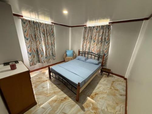 Llit o llits en una habitació de Max Cozy Corner