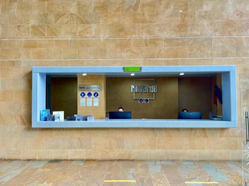 a building with a window on the side of it at Rioverde Living suites- Apartahotel in Rionegro