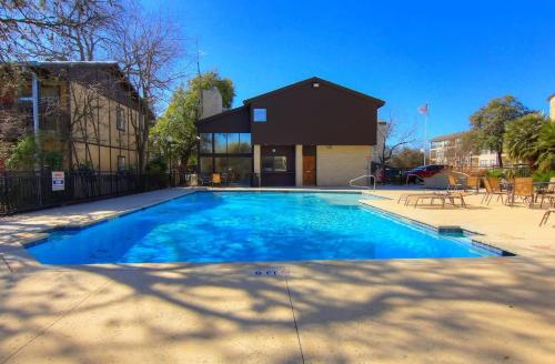 a swimming pool in front of a house at CW B206 Rivers Edge in New Braunfels