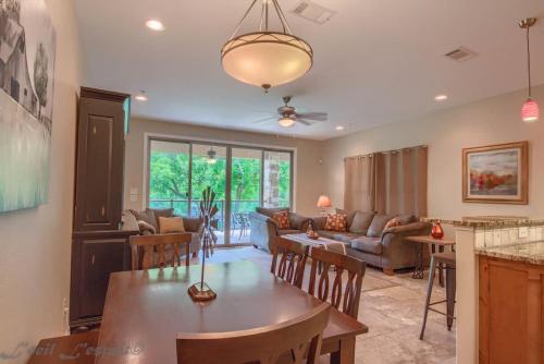a kitchen and living room with a table and chairs at RG 203 Riverview Terrace in Canyon Lake