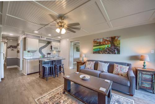 a living room with a couch and a table at RRC A302 River Hippie in New Braunfels