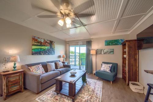 a living room with a couch and a table at RRC A302 River Hippie in New Braunfels