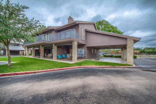 a large house on the side of a street at CW C104 Fun on the Comal in New Braunfels