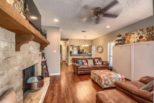 a living room with a couch and a fireplace at CW C104 Fun on the Comal in New Braunfels