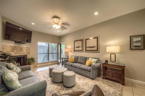 a living room with two couches and a fireplace at CW B202 Camp Boogie Bahn B202 in New Braunfels