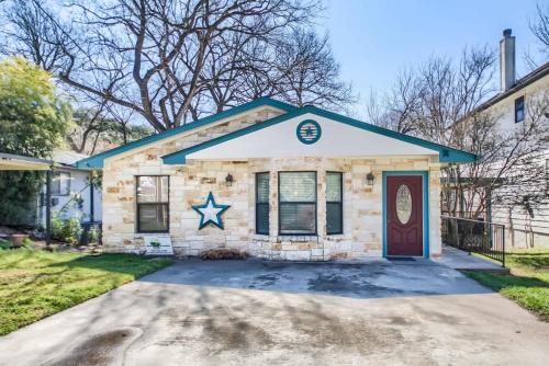 a house with a star on the front of it at RR 1300 Hondos River Haus in Canyon Lake