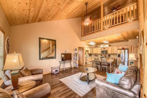 a living room with a couch and a table at OM A14 Gruene Bridge Bungalow at Old Mills Resort in New Braunfels