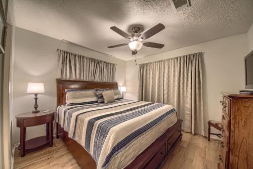 a bedroom with a bed and a ceiling fan at CRC 317 Timeless Tranquility in New Braunfels