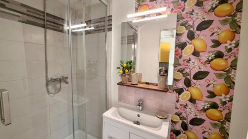 a bathroom with a sink and a shower at La Suite Limoncello, Sunny & Spacious in Nîmes